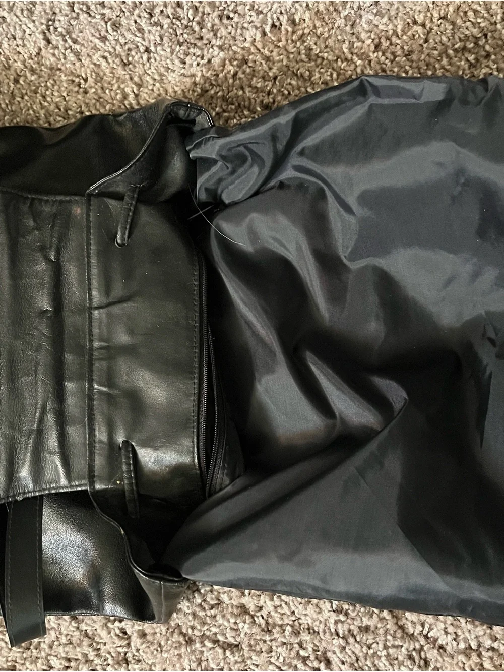 JJs House Black Leather Drawstring Flap Backpack